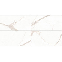 large white marble tiles laying tile in bathroom