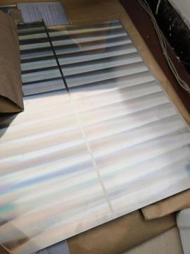 Tinplate with laser effect