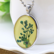 Epoxy and resin pendant in stainless steel