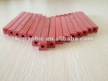 Red plastic cutting stick with hole inside