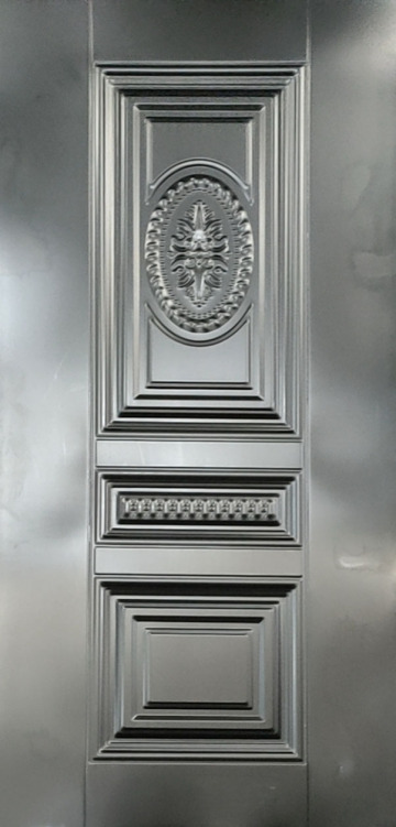 Decorative steel door panel