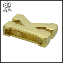 Gold K letter plate on the leather bag