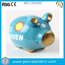 Blue color glazed ceramic pig shape coin bank wih decal