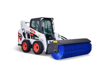 Skid steer loader for mixing plant sweeping