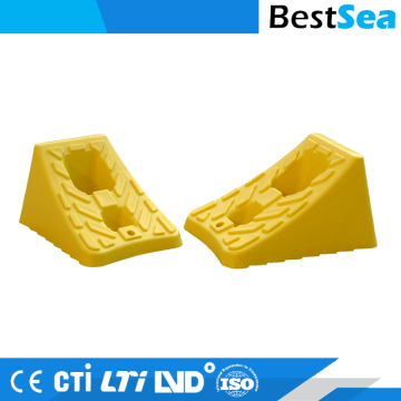 Yellow plastic car wheel chock