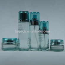 straight round glass lotion bottle and cream jar
