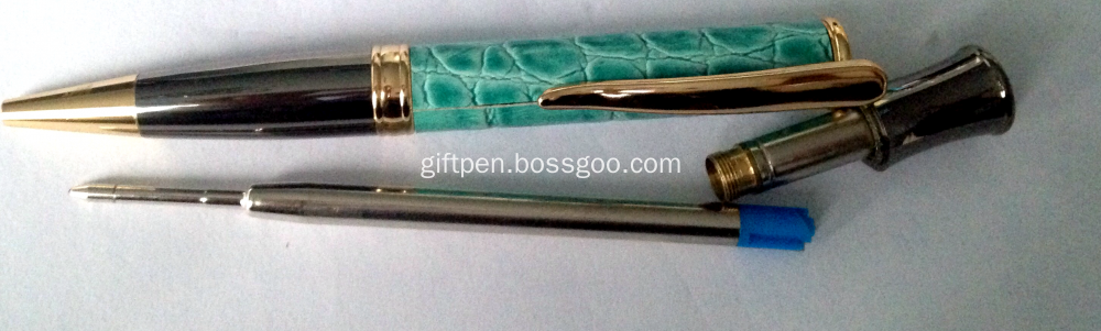 gunmetal and golden trim pen