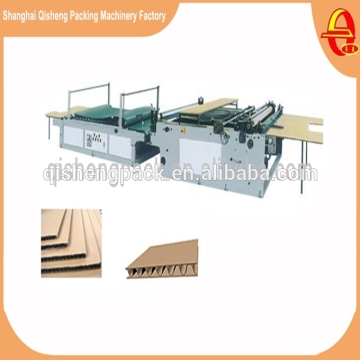 Automatic laminating machine for paperboard