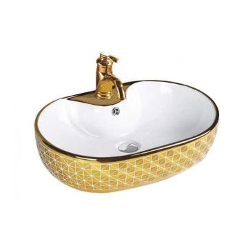 Lavabo de cerámica con diseño de color dorado