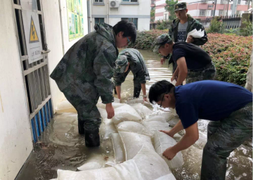 Water absorbent sandless sand bags for flood control