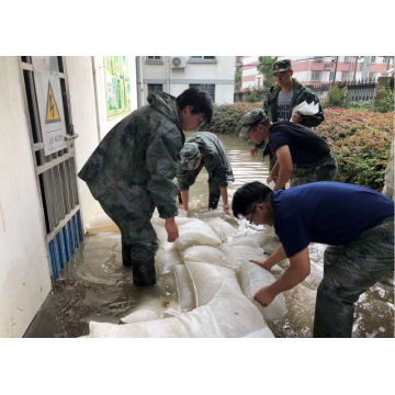 Water absorbent sandless sand bags for flood control