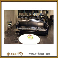 black leather three-seater sofa