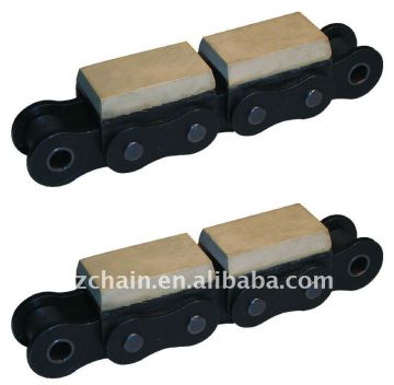 Roller chain with vulcanised elastomer profiles