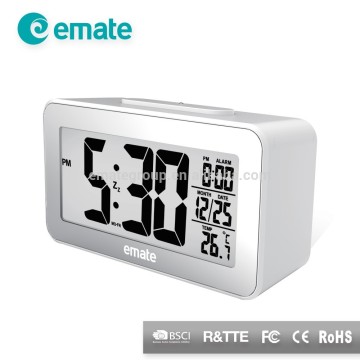 Digital alarm clock with light sensor