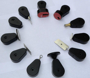 Retractors and Tethers for Retail Store Displays