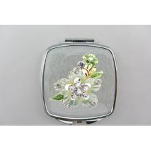 Espelho compacto de flores e plantas