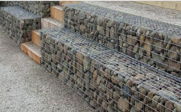 Gabion wall made of stones in the steel mesh