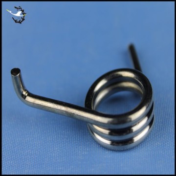 Custom hook torsion spring for agricultural machine