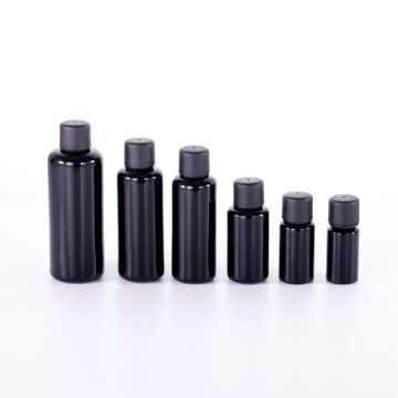 Bottiglia di olio di vetro nero con tappo evidente manomissione