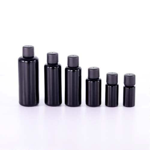 Black glass oil bottle with tamper evident cap