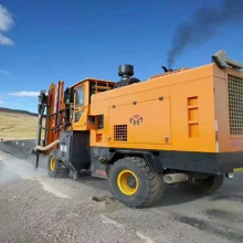 Highway guardrail piling machine