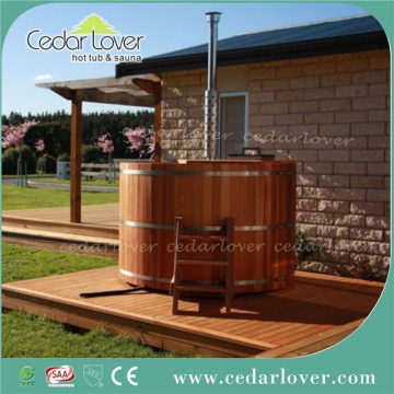 Outdoor wood hot tub with stove