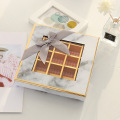 Caja de papel de chocolate de ventana transparente con incrustaciones de oro