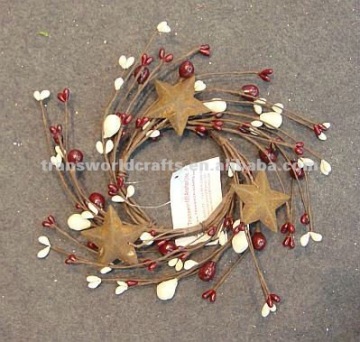 decorative candle ring with berries and tin stars