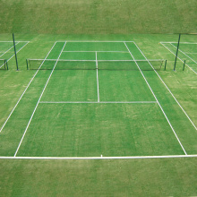 Campo de tenis de tenis de la comunidad y el campus Grass artificiales