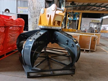 MONDE excavator orange stone grapple