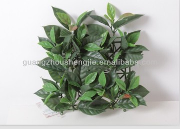 Artificial yulan magnolia tree leaves grass