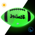 Green led light up bright glowing illuminated football that glows in the dark