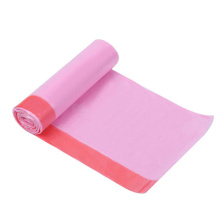 Plastic disposable drawstring trash bags on rolls for kitchen household can bins