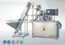 non spill cap labeling/sealing machine