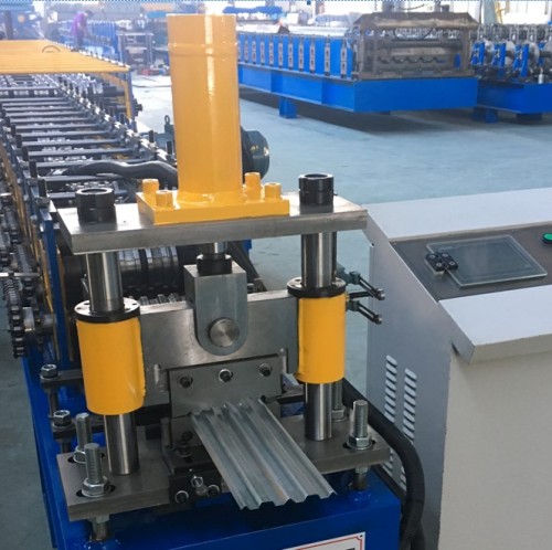 Roll forming machine for standing seam roof panels