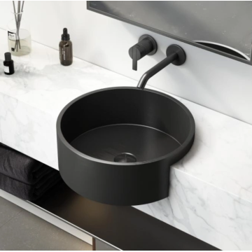 Stainless steel wash basin with black countertop