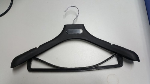 black plastic suit hanger wiht pants bar