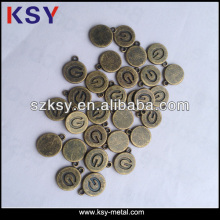 Engraved small bulk metal charm
