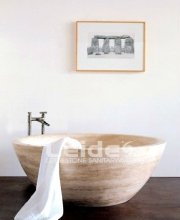 Beige travertine round bathtub