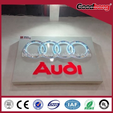 metal praying 3D logo car reseller advertisement