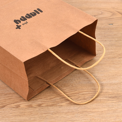 Sac en papier kraft brun avec logo imprimé personnalisé pour l&#39;emballage de vêtements