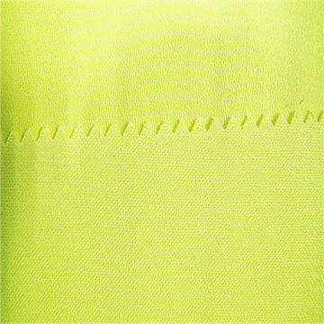 Fluorescerande 85% polyester 15% bomull 4/1 satintyg