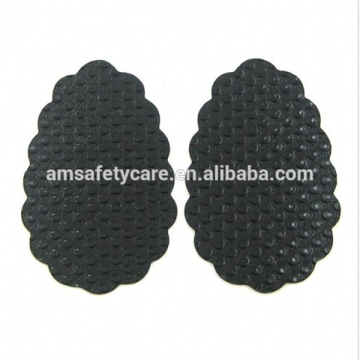 Anti-slip adhesive pads for shoe soles