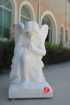 Cemetery kneeling angel statue