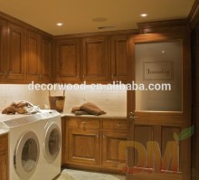 honey color Maple wood laundry room custom cabinetry