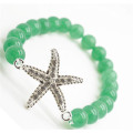 Браслет из зеленого авантюрина с кусочком морской звезды из сплава Diamante