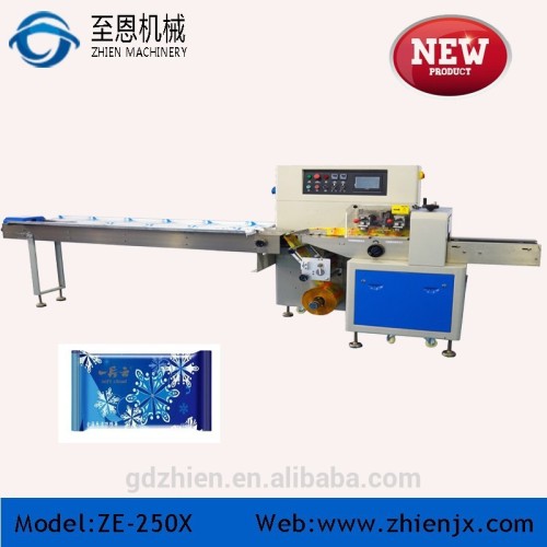 Hot sale down-paper candy/bread/biscuit/chocolate/cake pillow packing machine model no.:ZE-250X