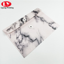 Folder With Marble Pattern and Botton String