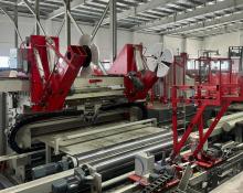 Automatic paper roll wrapping machine with Kraft paper