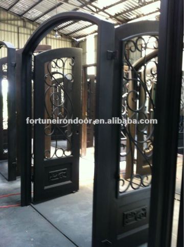 Wrought iron door with cast iron decorative door stops